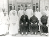 08.09.1931 at Ankwo. Ordination of Raymond Jaegher, dining r. Seated from left to right: X, Raymond Jaegher Bishop Sun, vicar apostolic of Ankwo, Vincent Lebbe. They are surrounded by priests.   [Album II Photo 120. Neg: 13 A IV? 14]