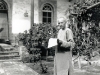 Probably in 1916, in Tientsin (?). Father Lebbe holds in his hand a Chinese newspaper. This could be the \"Kwang-i-lou\" weekly founded in 1912, but more likely \"the I-shih-pao,\" daily launched by Father Lebbe in 10.1915.   [Gallery I, Photo 40. Neg: P 13]