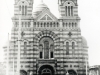 Around 1915-1916. Cathedral of Lao-so-k\'ai in Tientsin, built? in part with fees paid after the Boxer Rebellion? following the erection of the vicariate apostolic in 1912.   The aims of the consul of France to annex with the surrounding neighborhood, met his concession to the opposition of the population. The positions of the Father Lebbe for China provoked his expulsion, first Chengting, then Shaohing in Chekiang Province (South China).   [Gallery I, Photo 42. Neg: V 7]