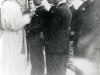 Easter 1923, \"The Firs\" in Verviers. Father Lebbe gives the baptism of three Chinese students. These Lyoutia Francis Gerard Ly Yong, Robert King Tsoei-li.   [Gallery I, Photo 64. Neg: II 48]