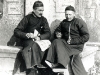 Shaohing (Chekiang), 01.1918.  Les Pères Antoine Cotta et Vincent Lebbe assis devant une stèle. et tenant en main l\'I-che-pao.  [Album I, Photo 46. Nég: P 19]